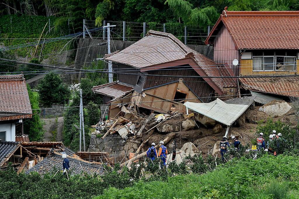 Rescue teams gather at the site of a landslide in Karatsu City, Saga prefecture on July 11, 2023, a day after heavy rains hit wide areas of Kyushu island. At least two people were killed in torrential rain in southwest Japan, as tens of thousands of residents were told to evacuate their homes. © Renaud Philippe / Greenpeace © KAZUHIRO NOGI/AFP via Getty Images